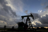 Oil ends steady; Saudi pledge, glut worry causes wild ride
