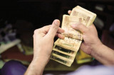 Rupee closes at 67.04 per US dollar