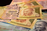 Rupee closes stronger at 68.42 per dollar as Jaitley sticks to fiscal deficit target