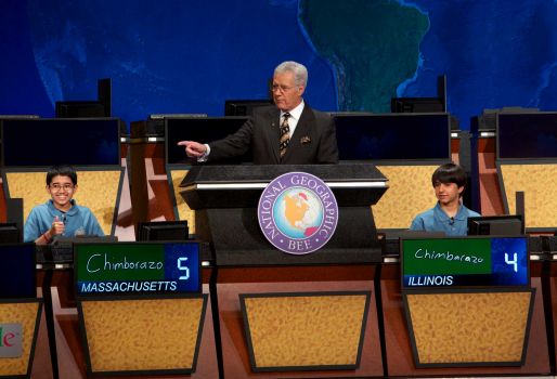 n this image released by National Geographic, National Geographic Bee winner Sathwik Karnik, left, of Massachusetts gives a thumbs-up as he correctly answers the final question posed by moderator Alex Trebek in Washington, on Wednesday, May 22, 2013. Runner-up was Illinois’ Conrad Oberhaus watches at right. Photo: National Geographic, Rebecca Hale