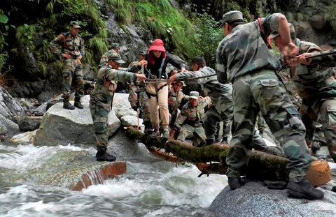 Army soldiers rescuing a woman at Pindari glacier in Uttarakhand, on Thursday