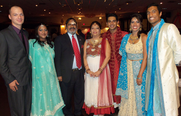 Sameet “Sam” and Indira “Ann” Bhushan flanked by their family at the 35th wedding anniversary celebration held last Saturday, July 6 at Milan Banquet Hall in Little India. From left, James Anderson with his fiancé Reena Bhushan; Sanjay Bhushan; Sonia Bhushan and her husband Raj Singhal.