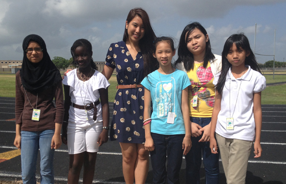Children’s Activities Intern Megan Nguyen (third from left) with students of the Alief ISD summer program.