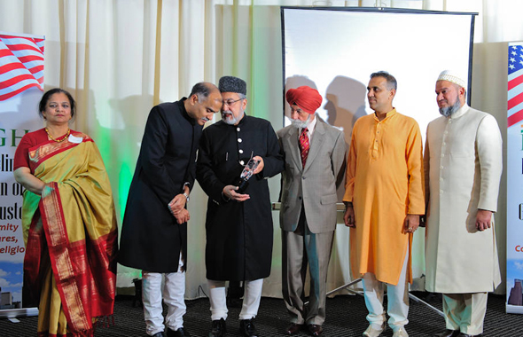 Emcee Dr. Zishan Samiuddin with the IMAGH Board and Col. Raj Bhalla who received a Community Service Award.
