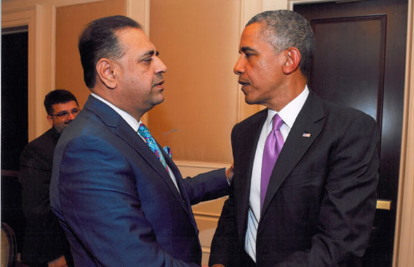 Houston businessman Lutfi Hassan meeting President Barack Obama at a business roundtable discussion on Thursday, July 11 at the White House.