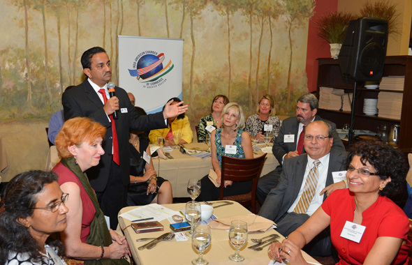 Pankaj Dhume, President IACCGH addressing the audience which included Board members and President Keri of the Fort Bend Chamber, Becci Himes of the British American Business Council  and the President of the Indian Cancer Network IACAN Kanchan Kabad.        Photos: Bijay Dixit