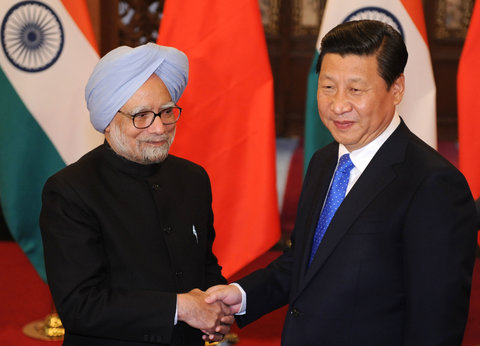 Manmohan Singh, left, prime minister of India, with Xi Jinping, president of China, in Beijing, China, on Oct. 23.
