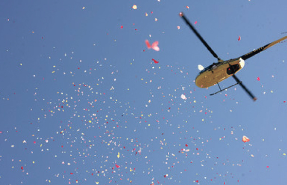 Flower Petals being showered from a helicopter at the time of Kumba Sthupi