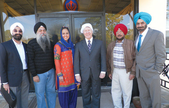 The Board of the Sikh Center escorted Judge Ed Emmett to the sanctuary. Bobby Singh (left) invited the Judge to the celebrations. Photos: Jawahar Malhotra