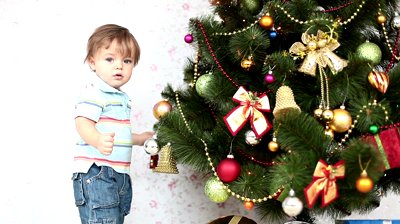 stock-footage-baby-boy-near-a-christmas-tree