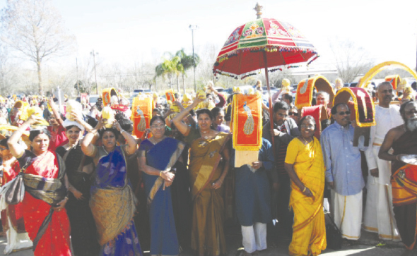 Devotees carrying Pal Kudams and Kaavadis in a sea of procession for the Abhishekam