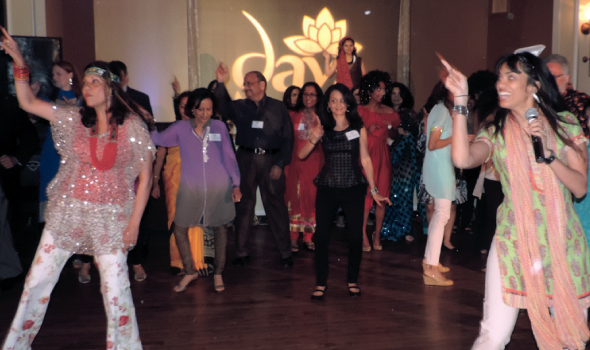 Dance instructor Anjali Thakkar (far right) led gala enthusiasts, such as advisory board member Sheela Rao (far left), in disco dancing as part of the “Dine and Disco for Daya” theme. 