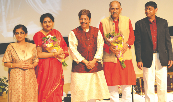 Indian Consul General P. Harish (center right) lauded the guru-shishya parampara (student-teacher tradition) fostered by Pandit Shantilal Shah. Joining them on stage were Hema and Ravi Iyer, founders of the Swaralayam Arts Forum (far left and far right) and Mrs. Nandita Harish. 