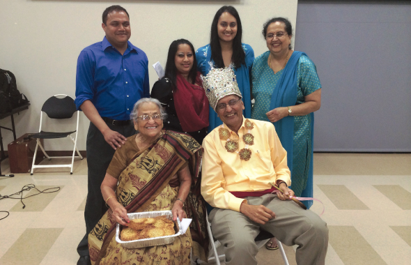 The Golikeri family enjoys a light hearted moment at the 90th birthday celebration of their matriarch, Radha, who was feted at a large gathering of friends and family last Saturday, April 26. Grandchildren (left to right) Rohit, Reema and Rita and daughter-in-law Ranjana and son Sudhir enjoyed the moment. They also celebrated Sudhir’s upcoming birthday (the next day) with a crown and impromptu flute in the traditional Marathi style.