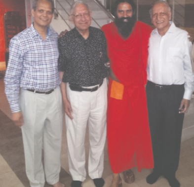 From left: Shekhar Aggarwal, Durga Aggarwal, Swami Ramdev, and Braham Aggarwal. 