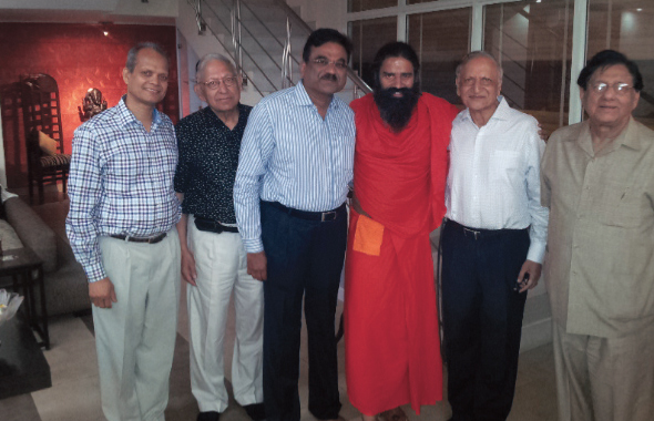 From left: Shekhar Agrawal, Durga Agrawal, S. M. Gavai, Braham Aggarwal and Bhishma K. Agnihotri with Swami Ramdev in Delhi.