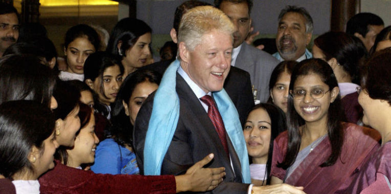 File photo of former U.S. President Bill Clinton meeting with students of the Ram Rati Gupta Women's Polytechnic School of Rampur, Uttar Pradesh, in New Delhi Nov. 21, 2003. He will now make another trip to India beginning July 16, 2014. (AFP/Getty Images)