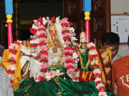 Devotees carrying Lord Nataraja Utsava Murthy in a procession at Sri Meenakshi temple during Aani Thirumanjanam.
