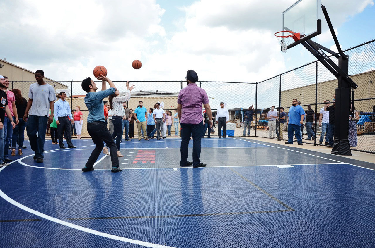 Pankaj Malani (with ball) joined employees in a quick game of basketball.