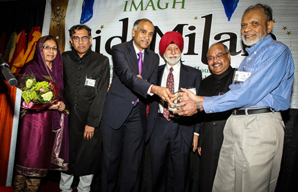 Indian Consul  General Parvathaneni Harish handing out the Community Award to Basheer Mohammed as, from left, Mrs. Mohammed, presenter Maqbool Haq, Col. Raj Bhalla (in red turban) and IMAGH Presidient Latafath Hussain enjoy the moment.