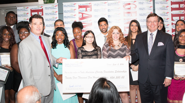Ft Bend District Attorney John Healy (left) and FBISD Trustee Jim Rice (right) with some of the students who received part of the $25,000 scholarship fund that the IACF distributed.