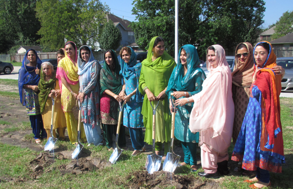 The volunteer teachers of the Punjabi School with the ceremonial shovels.