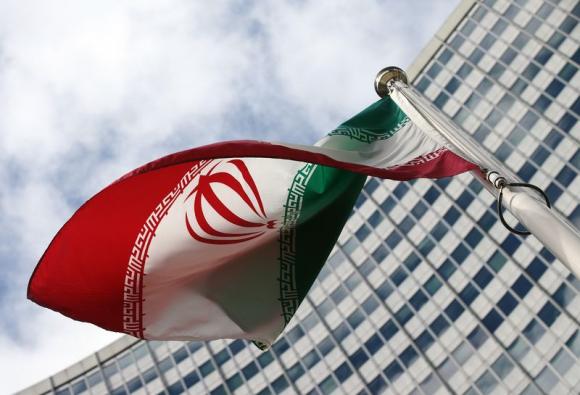 An Iranian flag flutters in front of the United Nations headquarters, during an IAEA board of governors meeting, in Vienna