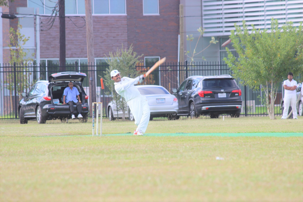Man of the Match Kishore from Houston Oilers Cricket Club (HOCC) hitting a boundary in the 18th over against CJCC.