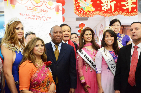 Houston Mayor Sylvester Turner with Texas International Lunar Festival Chairman Wea Lee behind him, TV Houston founder Sangeeta Dua and several local area beauty queens.