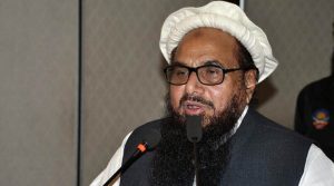 Hafiz Saeed, Chief of Pakistan's religious group Jamaat-ud-Dawa addresses a seminar in Lahore, Pakistan, Monday, Jan. 30, 2017. ÔªøPakistan has placed the leader of a charity linked to a militant group under house arrest. Hafiz Saeed, whose Jamaat-ud-Dawa is a front for Lashkar-e-Taiba, the group behind the 2008 Mumbai attacks, was placed under house arrest along with four aides.(AP Photo/K.M. Chaudary)