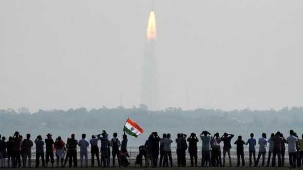 Indian onlookers watch the launch of the Indian Space Research Organisation (ISRO) Polar Satellite Launch Vehicle (PSLV-C37) at Sriharikota on Febuary 15.(AFP Photo)