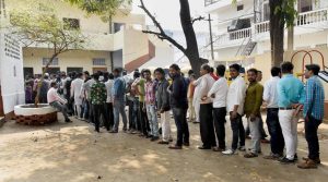 Lucknow: Voters queue up to cast their votes during the third phase of the UP assembly elections in Lucknow on Sunday. (PTI Photo)