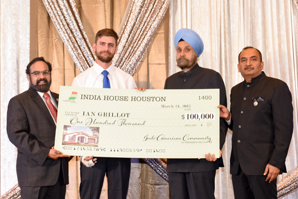 Ian Grillot (second from left) receives a check for $100,000 from India House Houston trustee Charlie Yalamanchili (left) and India House Gala Chair Jiten Agarwal (far right) with Indian Ambassador to U.S. Navtej Sarna. Photo: Bijay Dixit