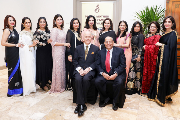 The Board of the Save A Mother Houston Chapter, with the founder Dr. Shiban Ganju, seated at left with Nat Krishnamurthy, the Treasurer.