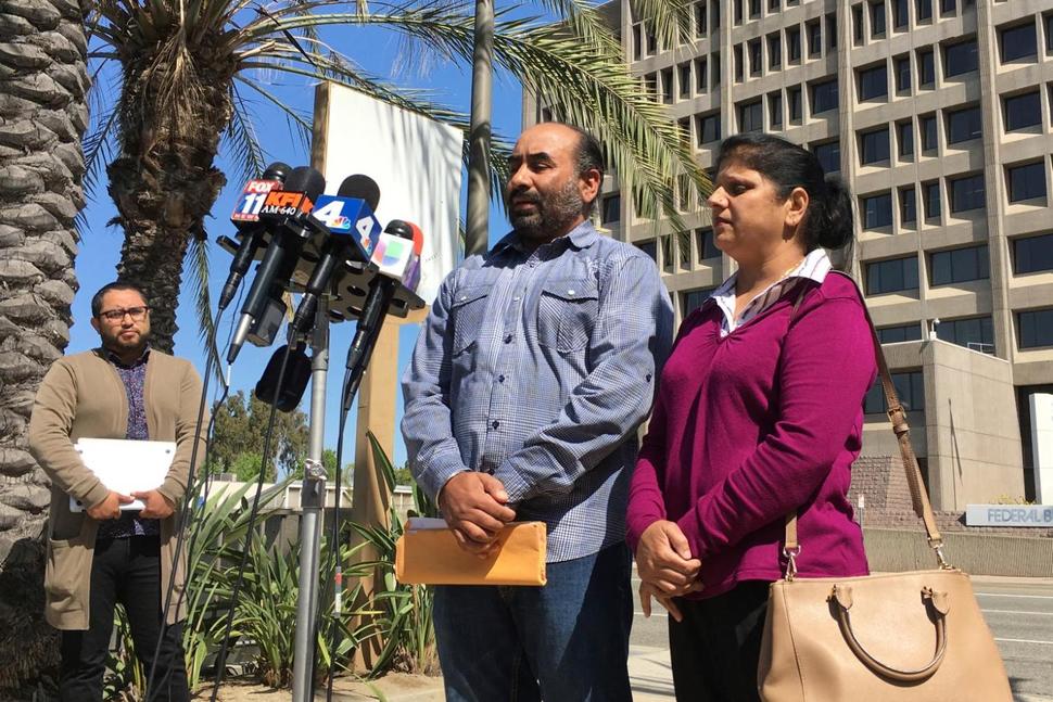 Gurmukh Singh, accompanied by his wife, talks during a news conference prior to his immigration check-in outside the Immigration and Customs Enforcement's offices in Santa Ana, Calif. on Monday, May 8, 2017. Singh a taxi driver originally from India has been detained by U.S. immigration authorities during a check-in for an 18-year-old deportation order. (AP Photo/Amy Taxin) THE ASSOCIATED PRESS