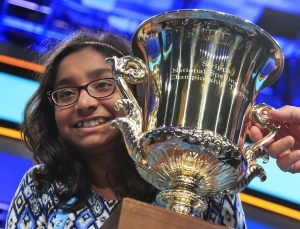 Ananya Vinay, a 12-year-old from Fresno, California, holds the trophy after being declared the winner of the 90th Scripps National Spelling Bee, in Oxon Hill, Maryland, on Thursday. (Manuel Balce Ceneta/AP)