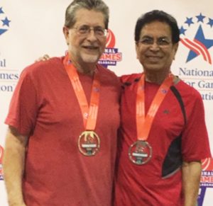 Dilip Desai (right) with partner Don Weems after winning the silver medal for National Seniors table tennis doubles tournament.