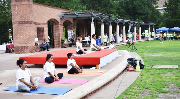 The yoga instructors gave direction on the asanas to the 450 people who came to the event