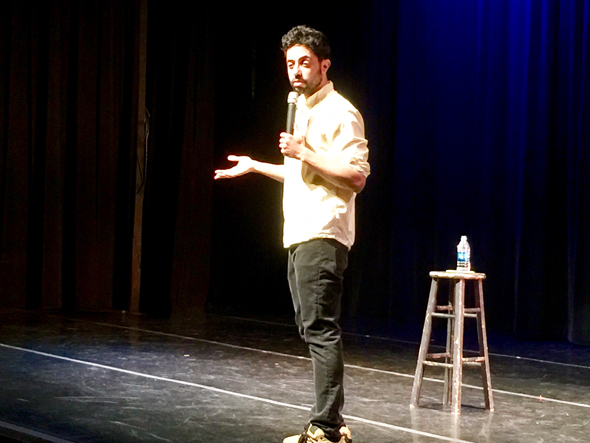 Commedian Sammy Obeid presented his act with bare essentials -- a wooden stool that he did not use and the first of three water bottles that he consumed. 