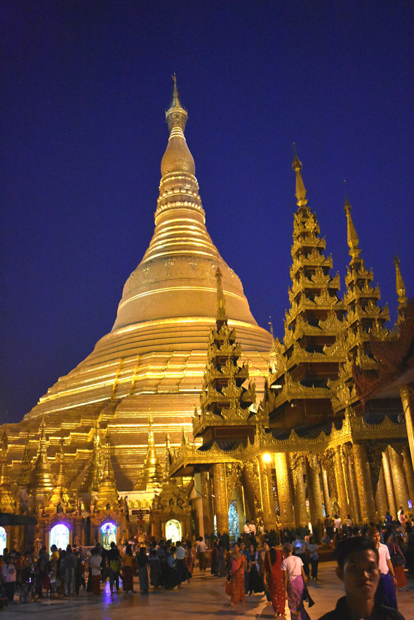The gilded Shwedagon Pagoda is lit up at night and can be seen from anywhere in the city