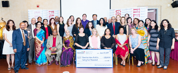 The IACF Board of Directors posed with the representatives of the charities which received the monetary awards