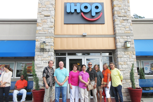 Datta-Barua (in sunshades) next to his wife and with his supporters at the IHOP in Kingwood.