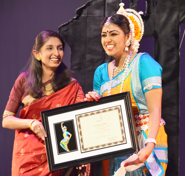 Meha Mohapatra after her Odissi debut performance with her guru Supradipta Datta who handed her the certificate of completion.