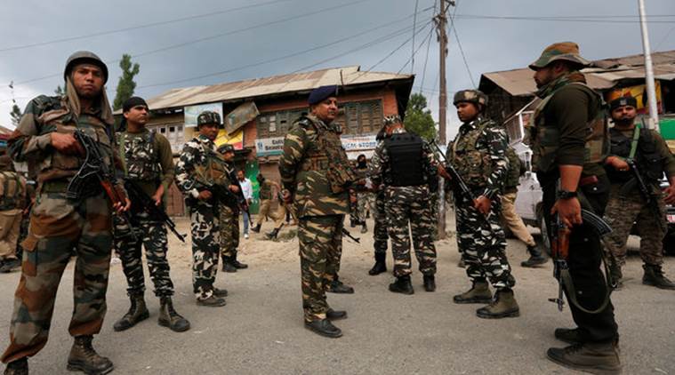 Indian security force personnel stand at the site of a gunbattle between Indian police and militants on Monday in which seven Hindu pilgrims were killed, in Boateng village in south Kashmir's Anantnag district July 11, 2017. REUTERS/Danish Ismail