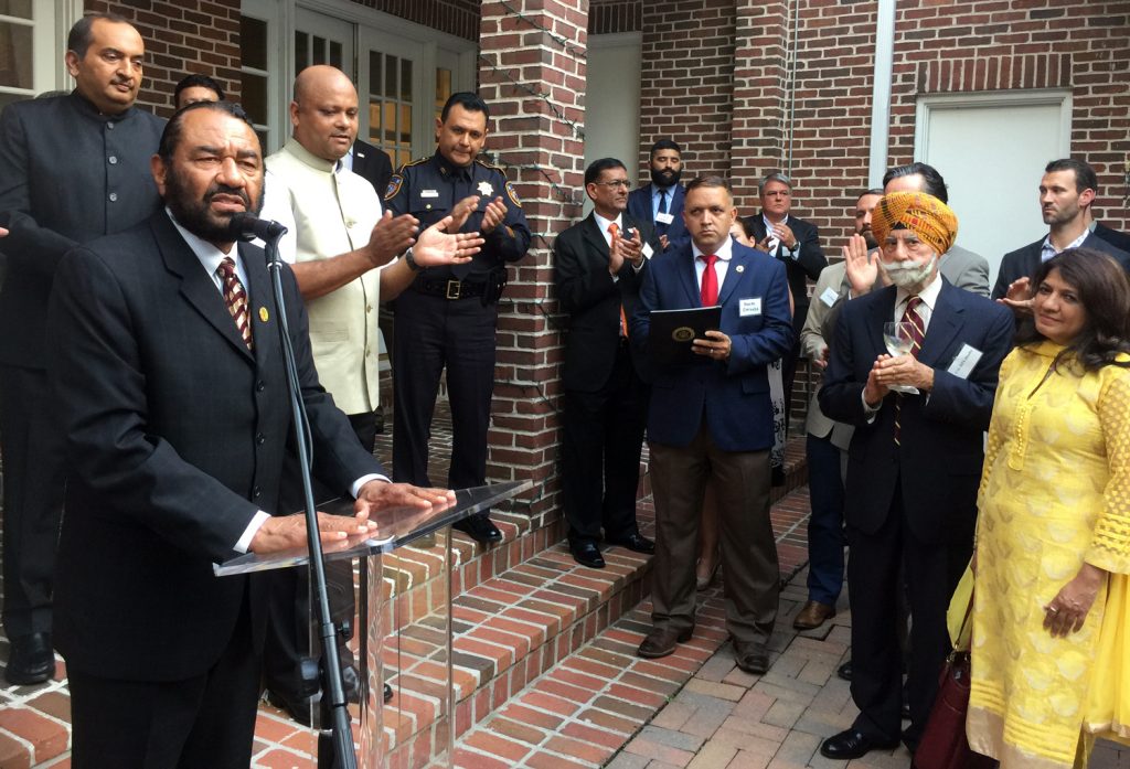 Congressman Al Green (at lectern) presented a Congressional Proclamation recognizing India’s Independence Day as dignitaries Jiten Agrawal (left), Consul General Anupam Ray, Harris County Sheriff Ed Gonzales applaud with Congressional aides with Col. Raj Bhalla and TV Asia’s Manisha Gandhi. 