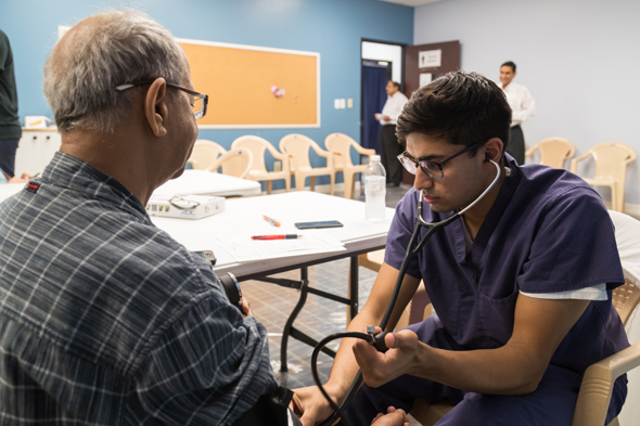Doctors perform health physicals at the health fair.