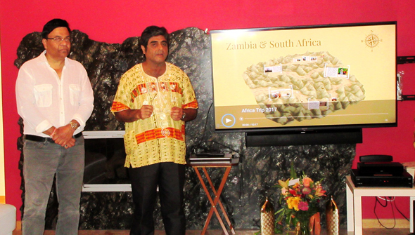 Connoisseurs Club co-founder Atul Vir introduces the topic – a tour of South Africa and Zambia - that Santosh Desai (left) was going to present.