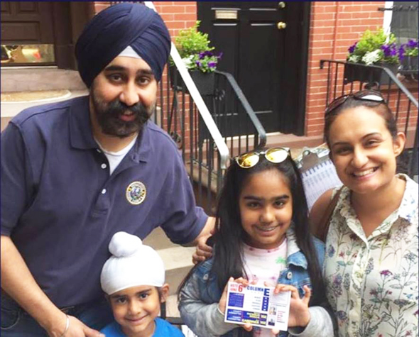 Ravinder Singh, Mayor-Elect of Edison, NJ with his wife Navneet and two kids