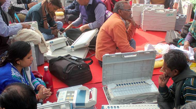Lucknow: Polling officers collect electronic voting machines(EVM) and polling materials before leaving for polling booth on the eve of second phase voting of Uttar Pradesh Nagar Palika Election 2017 UP, in Lucknow on Saturday. PTI Photo  (PTI11_25_2017_000094a)