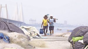 Fishermen return to their base at Worli Koliwada Monday. Nirmal Harindran